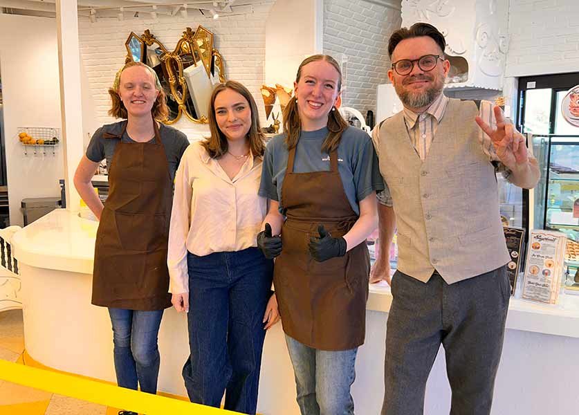 Jared Gold, right, with manager Kiya Upshaw, second from left, and other members of the Sugarbeast team. | Rett Nelson, EastIdahoNews.com