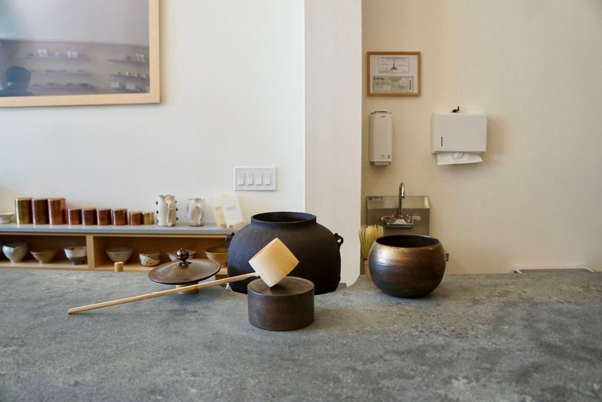 A collection of matcha tools on a stone counter at Kettl
