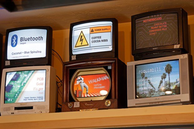 Older electronics are the decor for An's Electronics Repair, such as these menus on vintage televisions at the Ocean Beach gelato shop on Tuesday, April 15, 2025. (K.C. Alfred / The San Diego Union-Tribune)