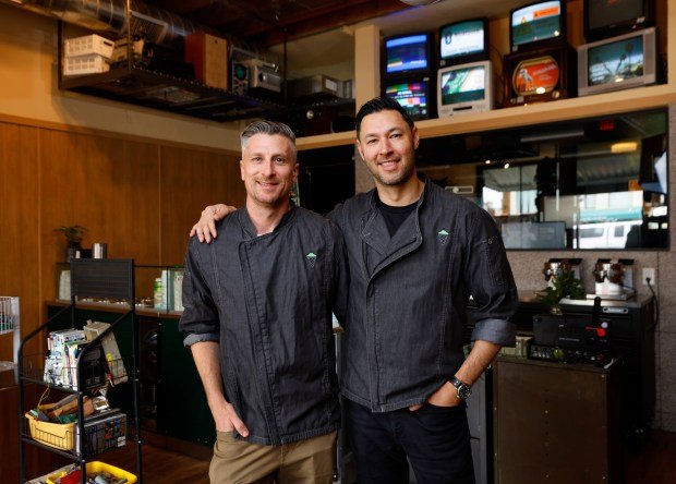 Travis Bailey and Kris Warren in their latest gelato shop, An's Electronics Repair in Ocean Beach on Tuesday, April 15, 2025. (K.C. Alfred / The San Diego Union-Tribune)