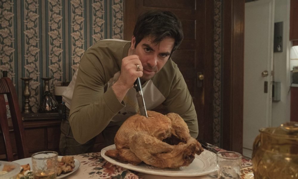 Eli Roth carving turkey