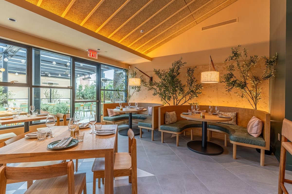 Circular banquettes with indoor foliage at Cosetta.