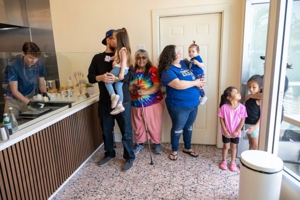 People wait in line for a free scoop of ice...