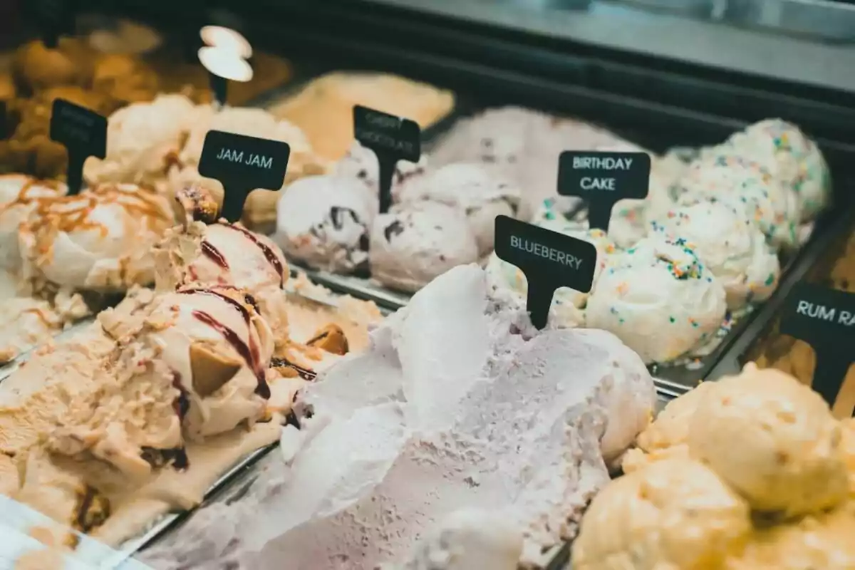 Various flavors of ice cream in a display case, including Various flavors of ice cream in a display case, including