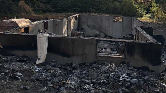 Investigators say a fire destroyed this home at 52 Maintenance Lane in Newfield, Maine, and left one person dead.