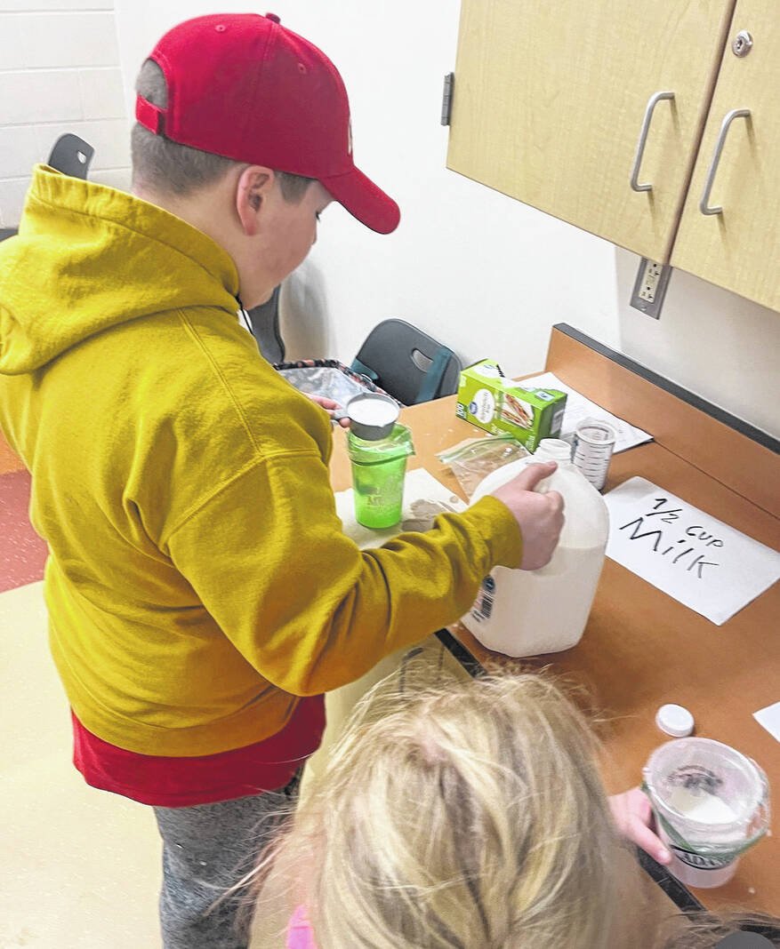 Fayette Farm Life members demonstrate how to make ice cream
