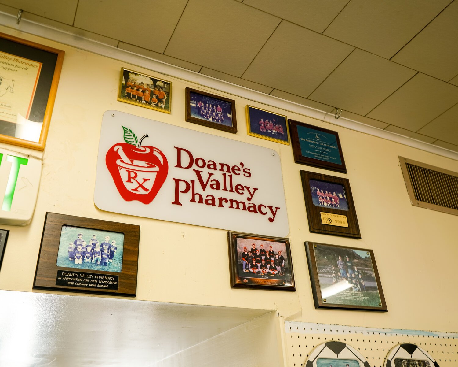 The youth sports teams that Doane’s has sponsored over the years fill far more than this wall with photos.